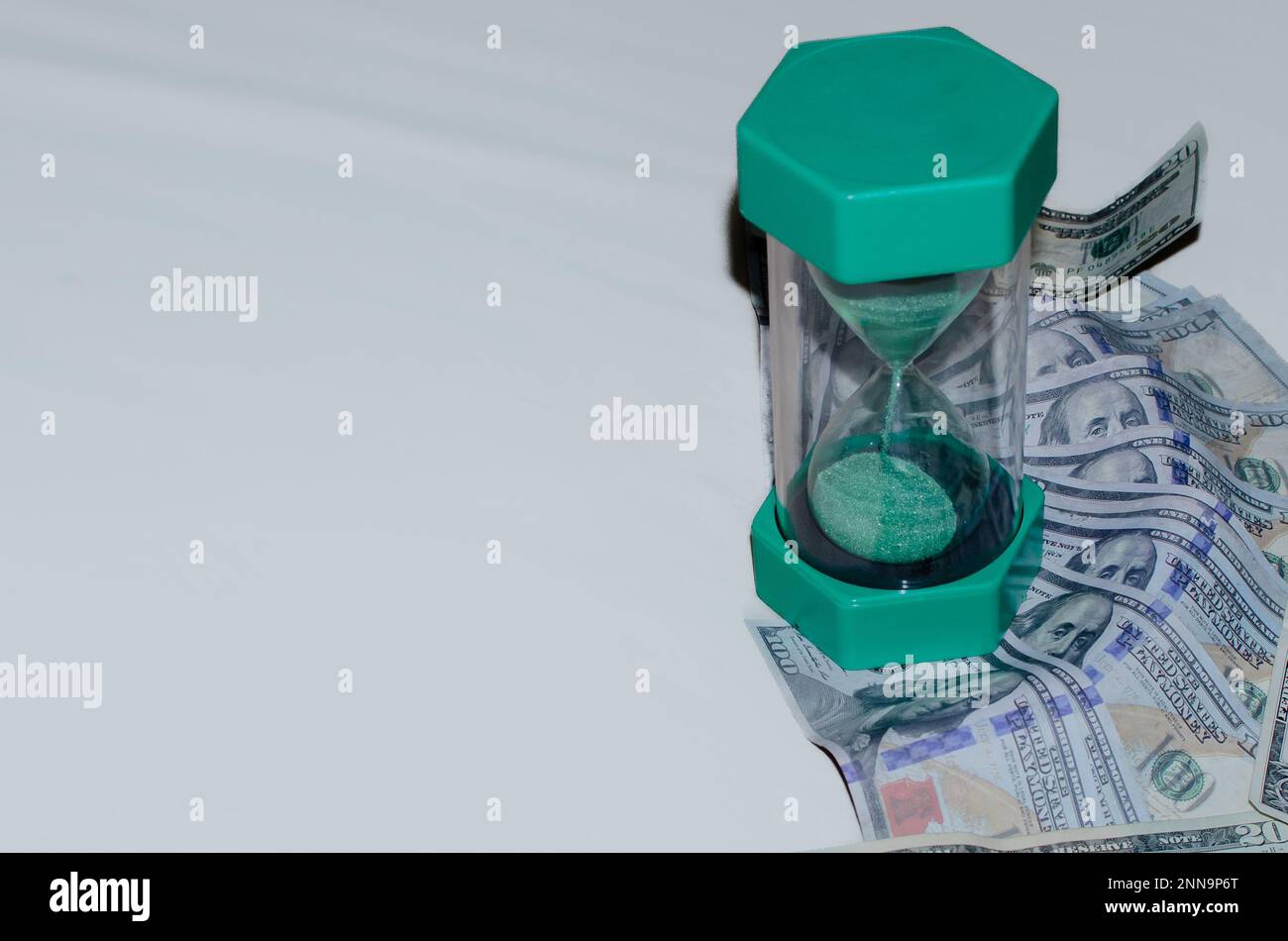 Money with clock hi-res stock photography and images - Alamy