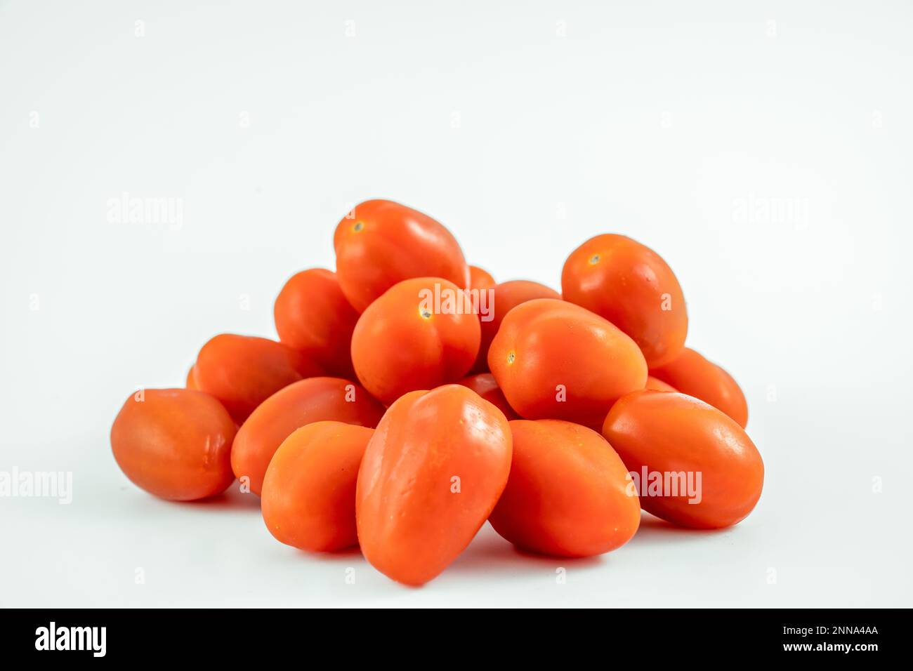 small italian plum tomatoes fresh and ripe isolated on a white ...