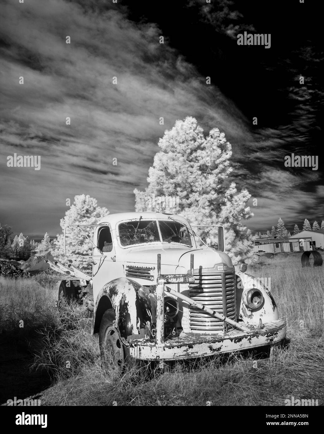 Infrared image of abandoned antique work truck. Stock Photo