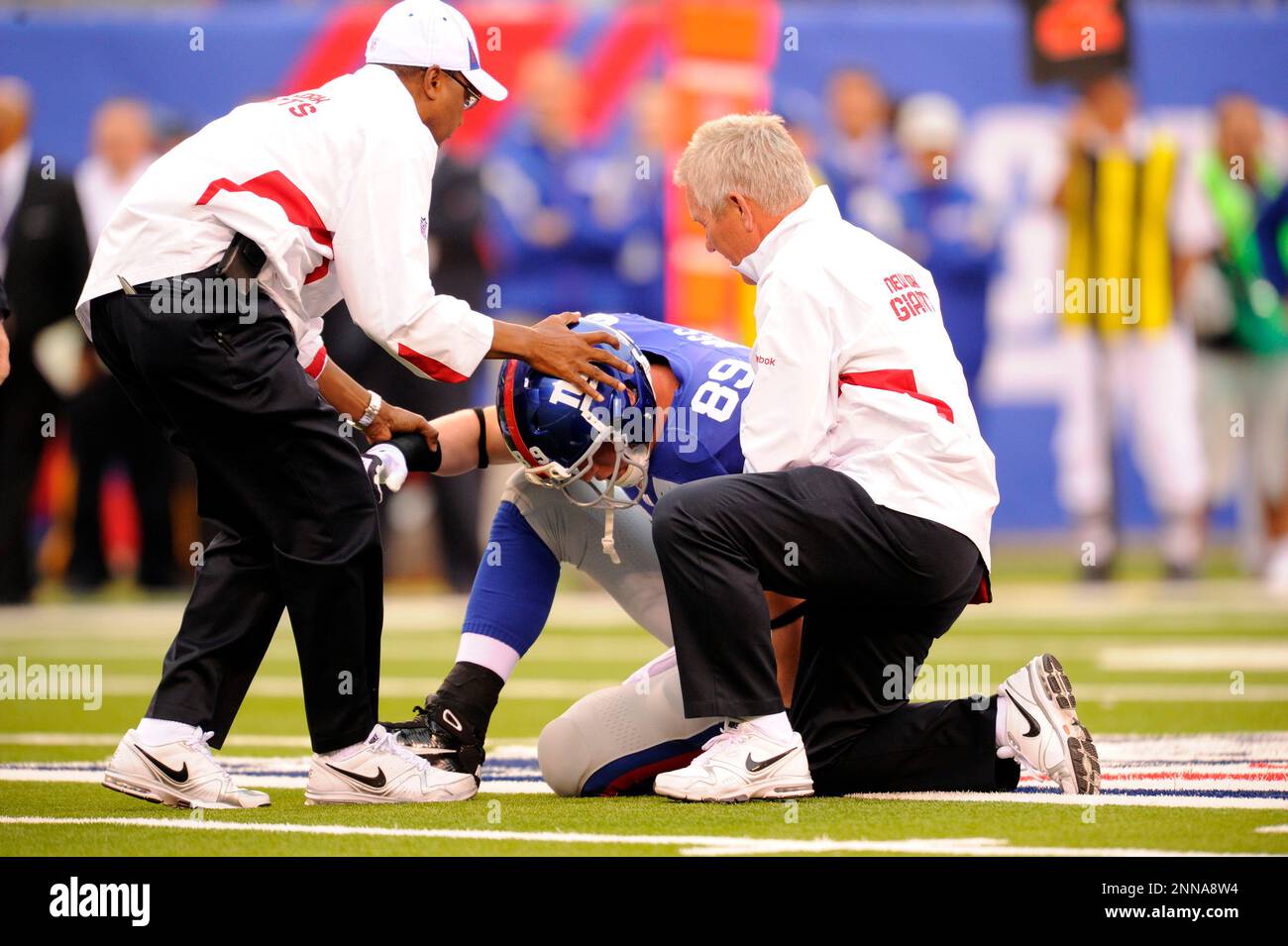 12 September 2010: New York Giants tight end Kevin Boss (89) is assisted by  trainers after getting hit by Carolina Panthers safety Sherrod Martin (not  pictured) during the first half of the