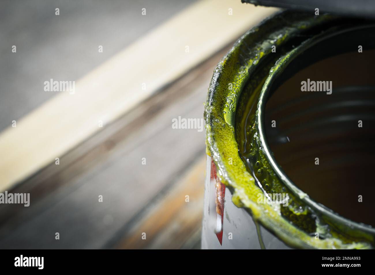 Tin containing adhesive glue used in carpentry for sticking plywood and