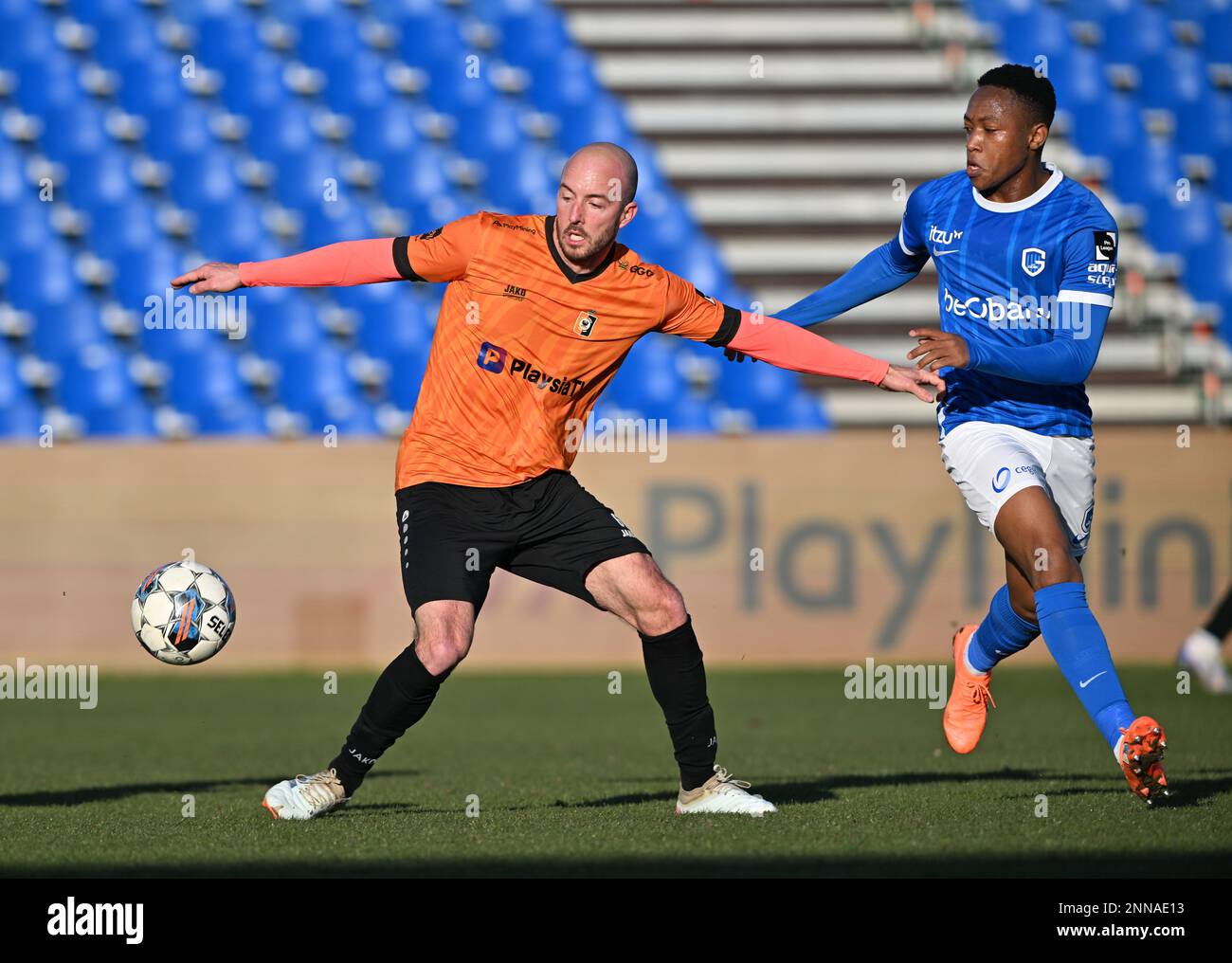 Deinze's Steve De Ridder and Jong Genk's Kelvin Pius John pictured in action during a soccer match between KMSK Deinze and Jong Genk (u23), Saturday 25 February 2023 in Deinze, on day 1 of the Relegation Play-offs of the 2022-2023 'Challenger Pro League' 1B second division of the Belgian championship. BELGA PHOTO DAVID CATRY Stock Photo