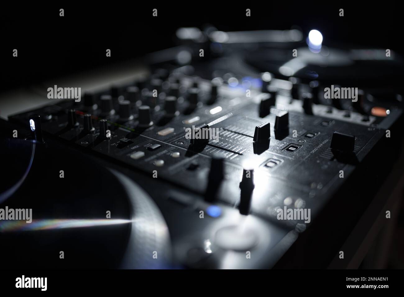 Dj setup on concert stage. Audio mixer and vinyl turntables for