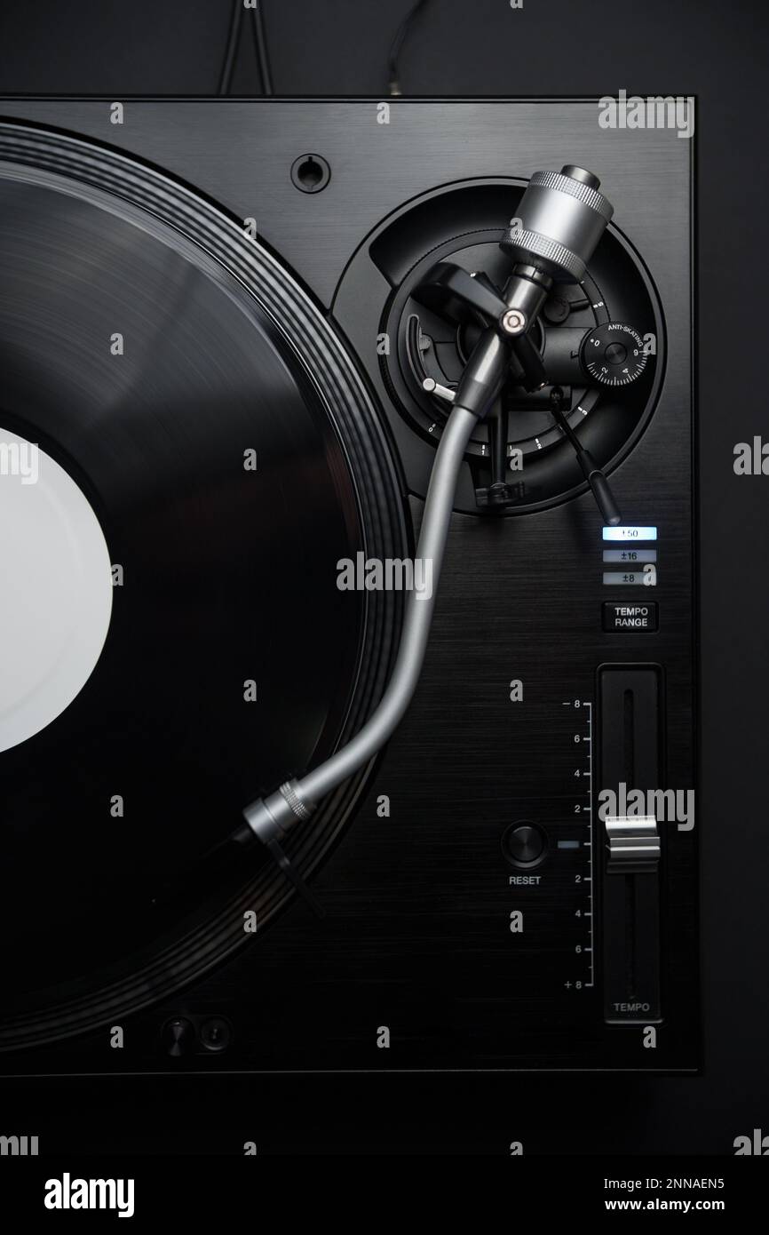 Dj turntable plays vinyl record with music. Professional audio equipment for hip hop disc jockey Stock Photo