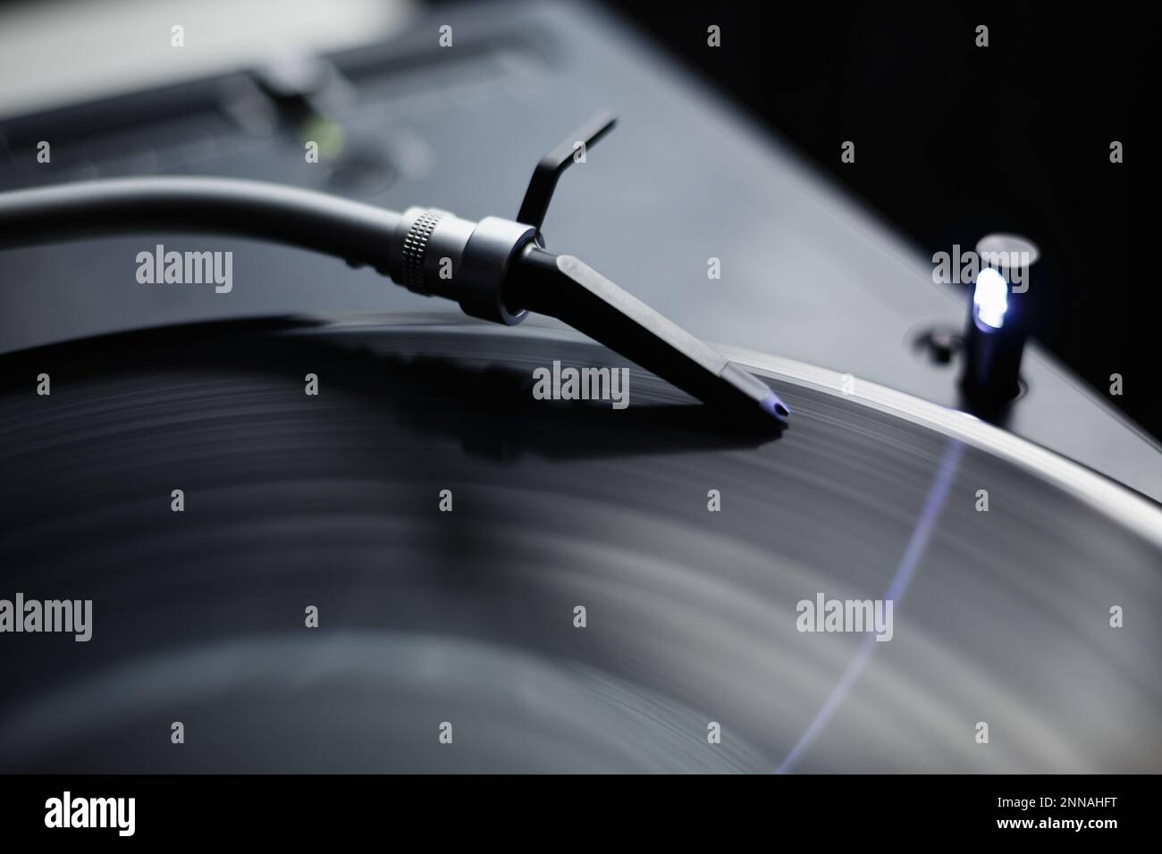 Turntables needle on vinyl record. Professional dj turn table player