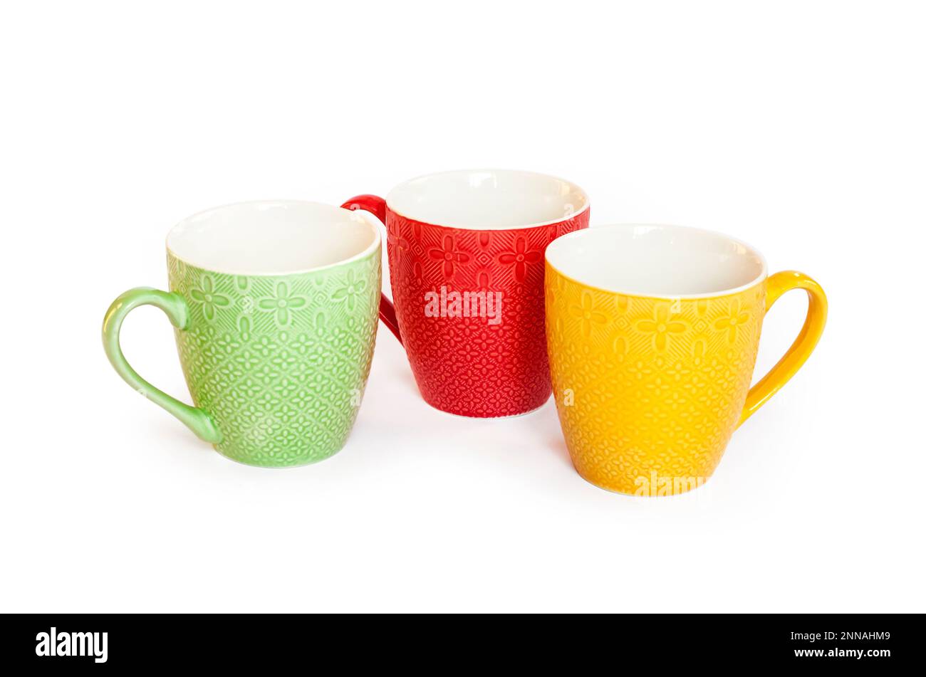 Three colorful mugs isolated on white background with clipping path Stock Photo