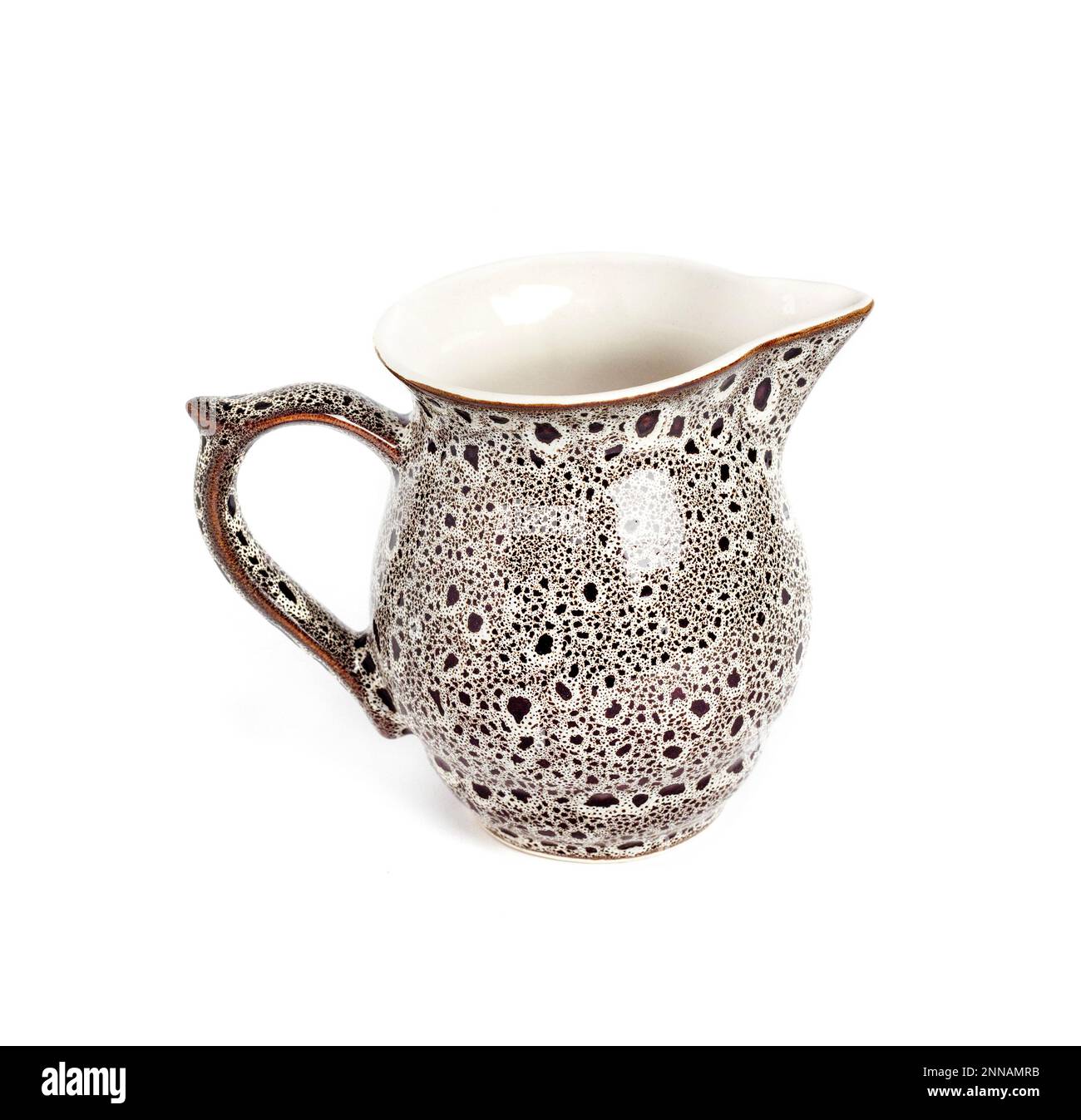 Glazed ceramic milk jar isolated on a white background Stock Photo