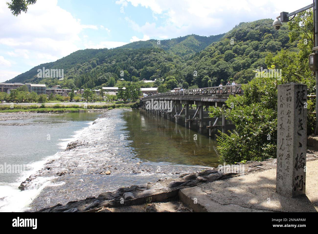 Togetsu-kyo Bridge with a stone monument (meaning an ancient love story) in Arashiyama, Kyoto, Japan Stock Photo