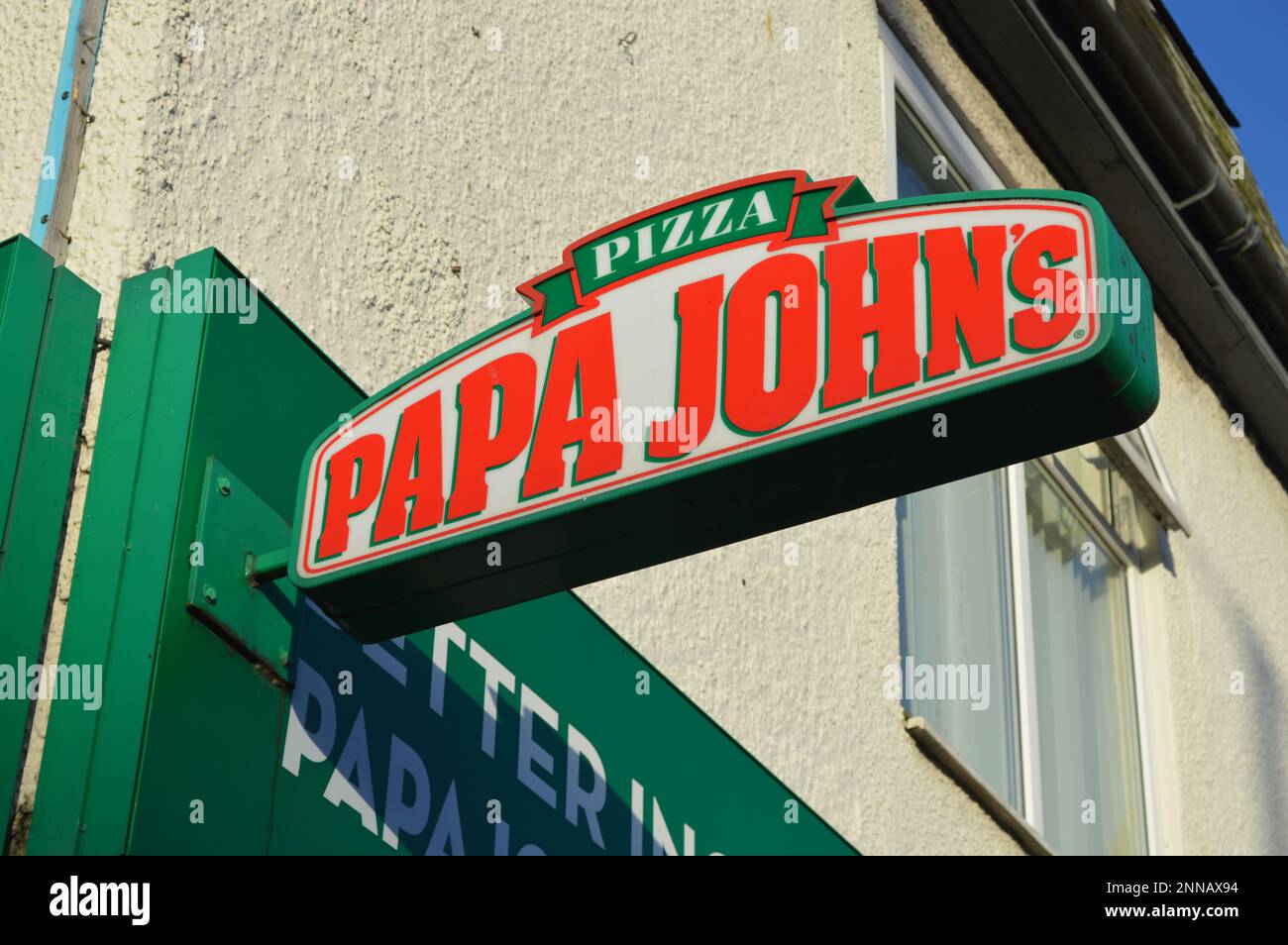 25th February 2023, Swansea, Wales, United Kingdom. Papa Johns Pizza outlet on Dillwyn Street. Stock Photo