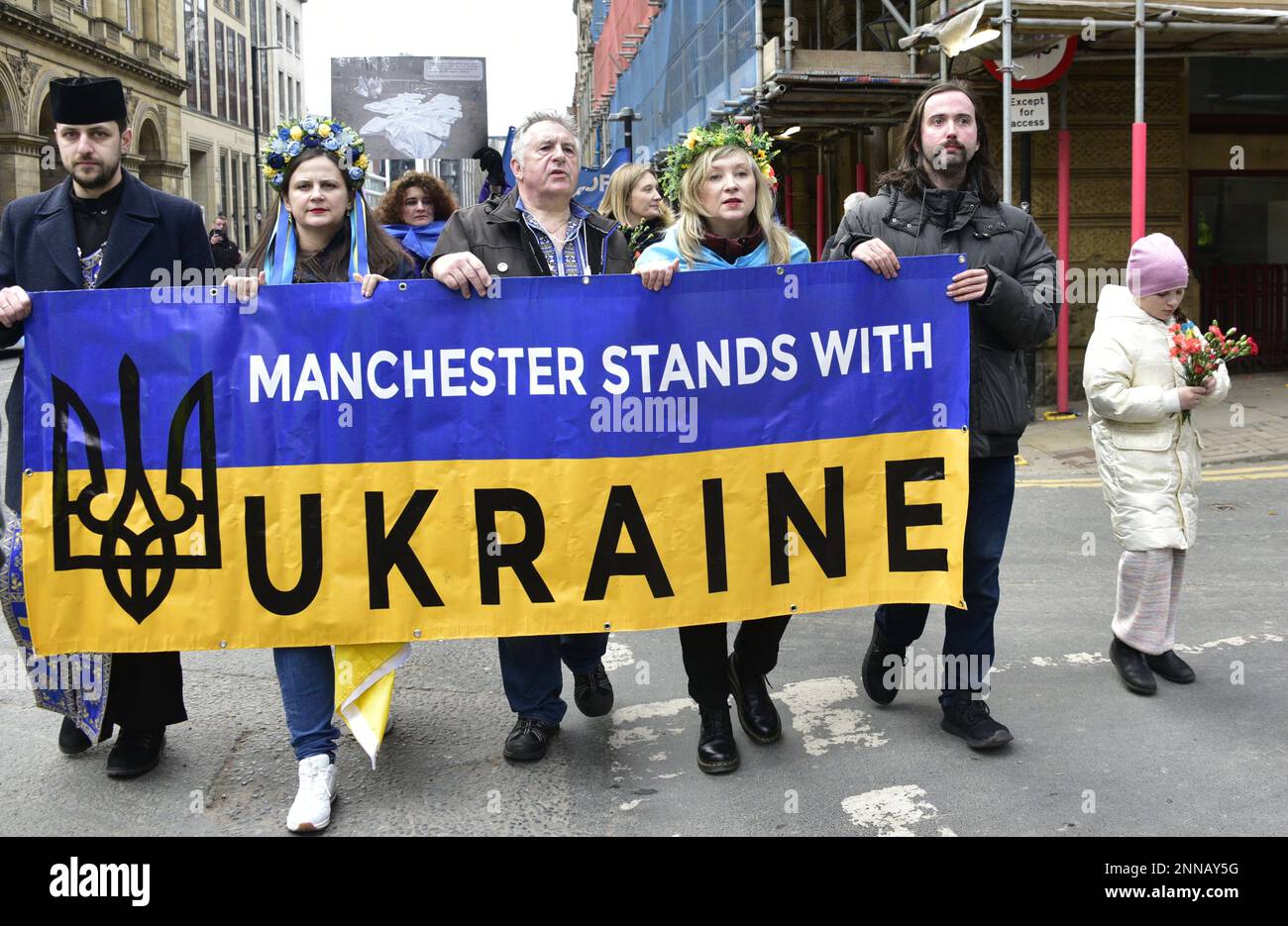 Manchester, UK, 25th February, 2023. Protest march through central Manchester, UK, about the Russian invasion of Ukraine on the day after the first anniversary of Russia's illegal invasion of Ukraine. The march and the rally afterwards in Piccadilly Gardens were organised by the Ukrainian Cultural Centre AUGB Manchester. Credit: Terry Waller/Alamy Live News Stock Photo