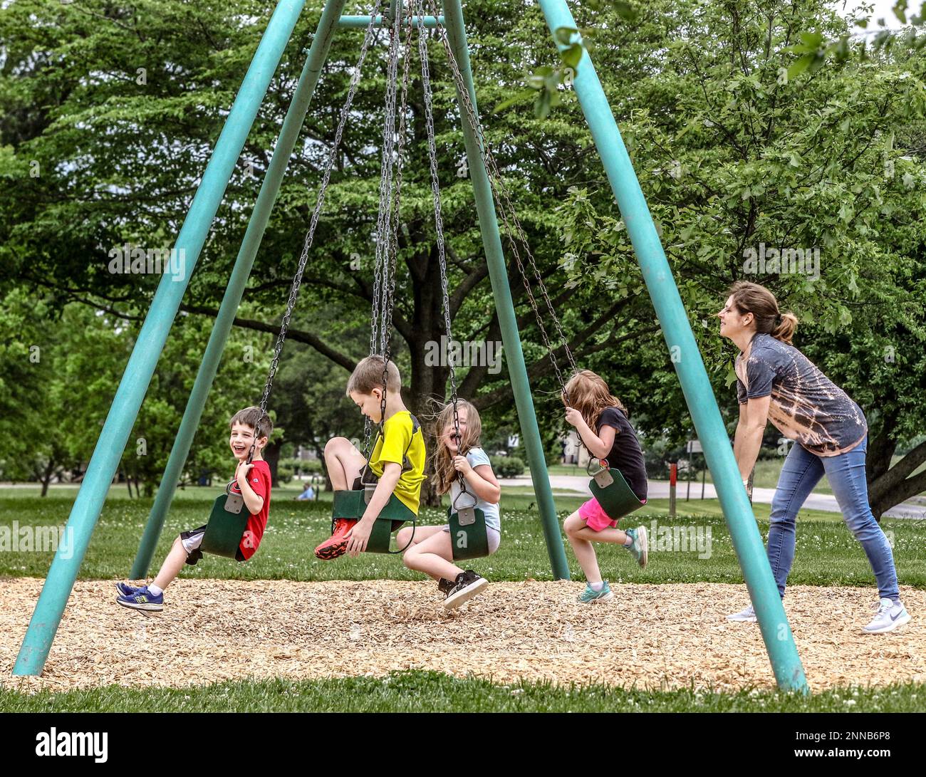 Sarah Patton spends time swinging with her son and and his friends