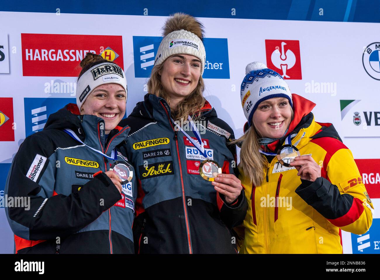 Winterberg, Germany. 25th Feb, 2023. Luge: World Cup, single-seater, women, 2nd run: runner-up Lisa Schulte (l-r), winner Madeleine Egle and third-placed Anna Bereiter are happy about their placings. Credit: David Inderlied/dpa/Alamy Live News Stock Photo