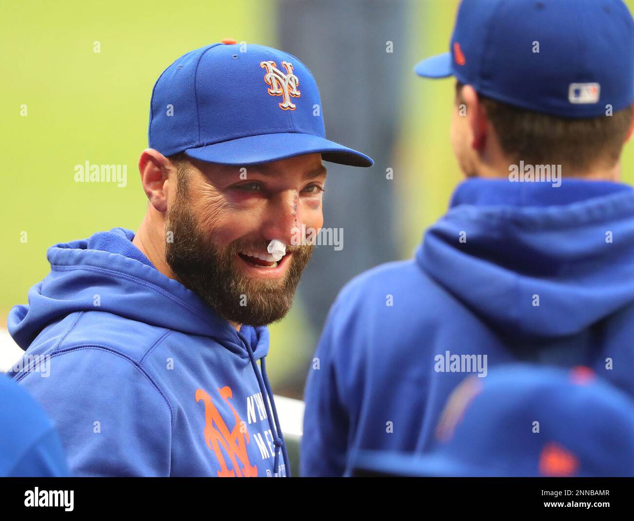 New York Mets' Kevin Pillar smiles in the dugout during the team's