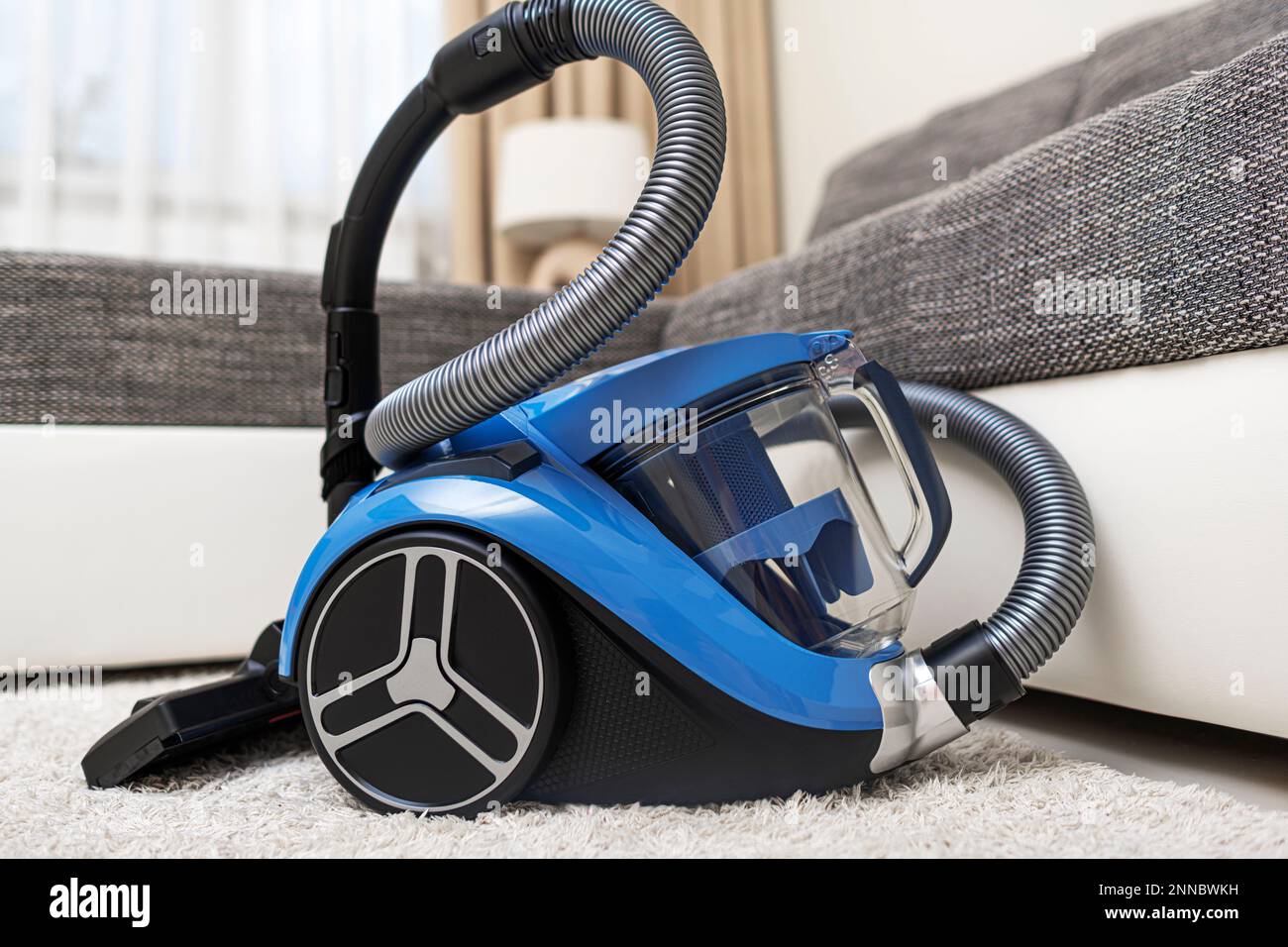 Modern vacuum cleaner in the living room Stock Photo Alamy