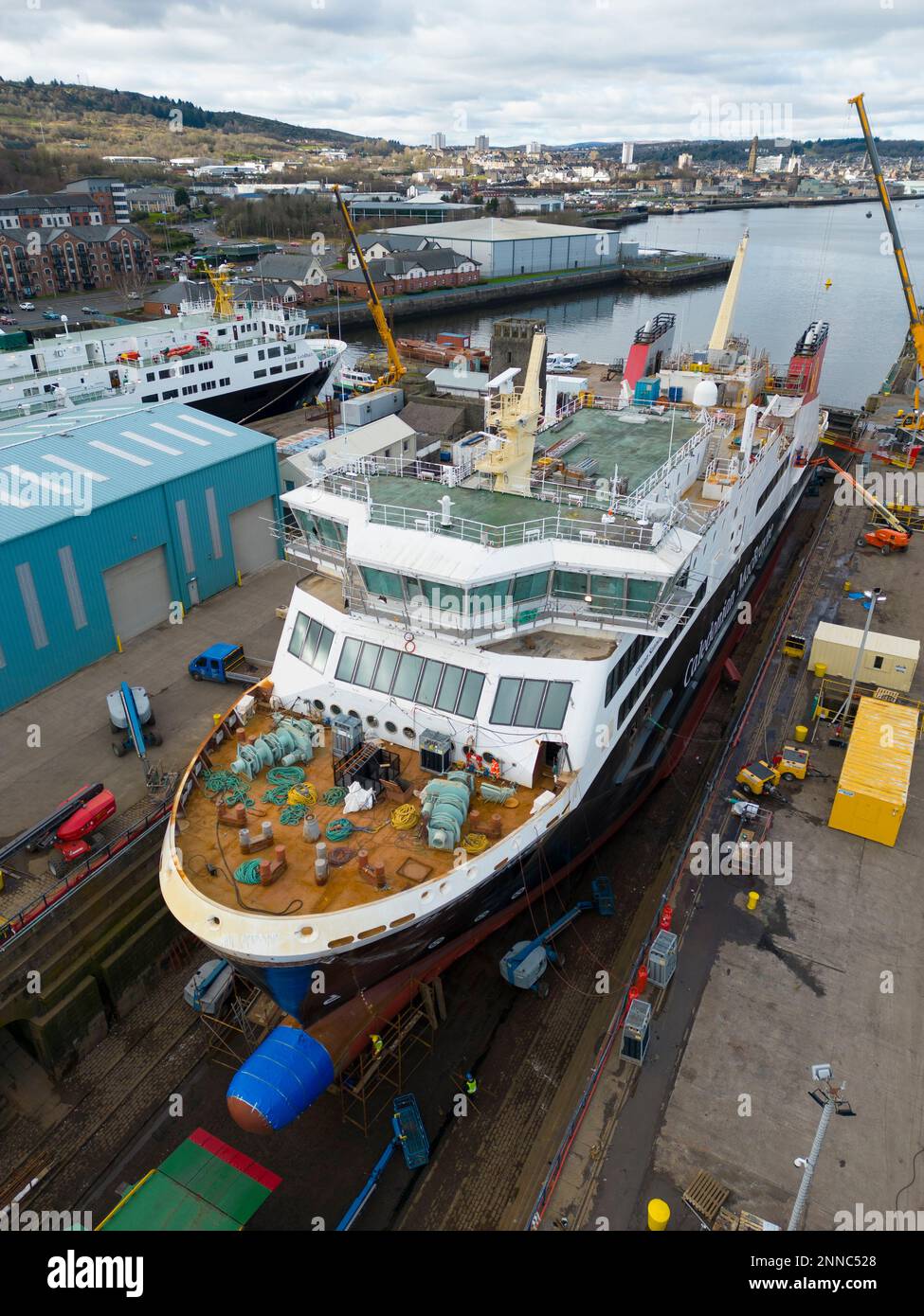 Greenock, Scotland, UK. 25 February 2023. Glen Sannox ferry is seen in dry dock at Greenock where she is being fitted out. Three other Caledonian Macbrayne ferries are also adjacent undergoing repairs and maintenance, Isle of Lewis, the Caledonian Isles and the MV Loch Fyne..These ferries are currently out of service for Calmac. Iain Masterton/Alamy Live News Stock Photo