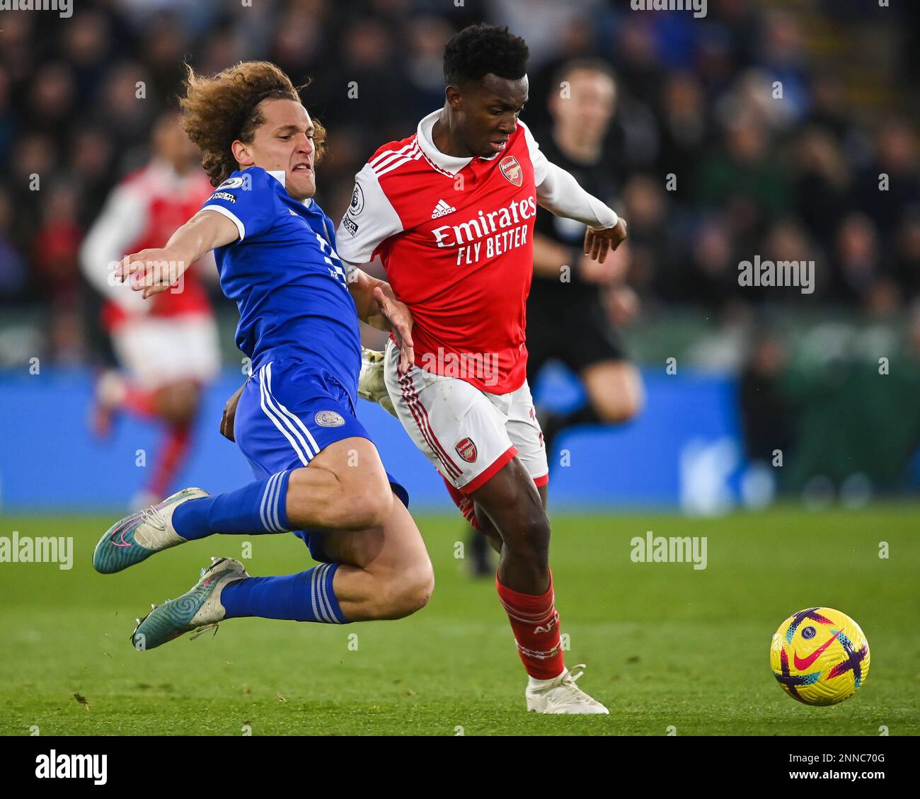 Eddie Nketiah #14 of Arsenal is tackled by Wout Faes #3 of Leicester City during the Premier League match Leicester City vs Arsenal at King Power Stadium, Leicester, United Kingdom, 25th February 2023  (Photo by Craig Thomas/News Images) Stock Photo