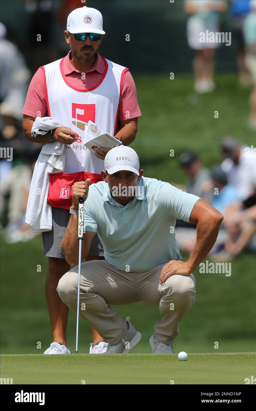 CHARLOTTE, NC - MAY 08: Caddie Jon Yarbrough and Scott Stallings (USA)  survey the slope of the 7th green during the third round of the Wells Fargo  Championship on May 08, 2021,