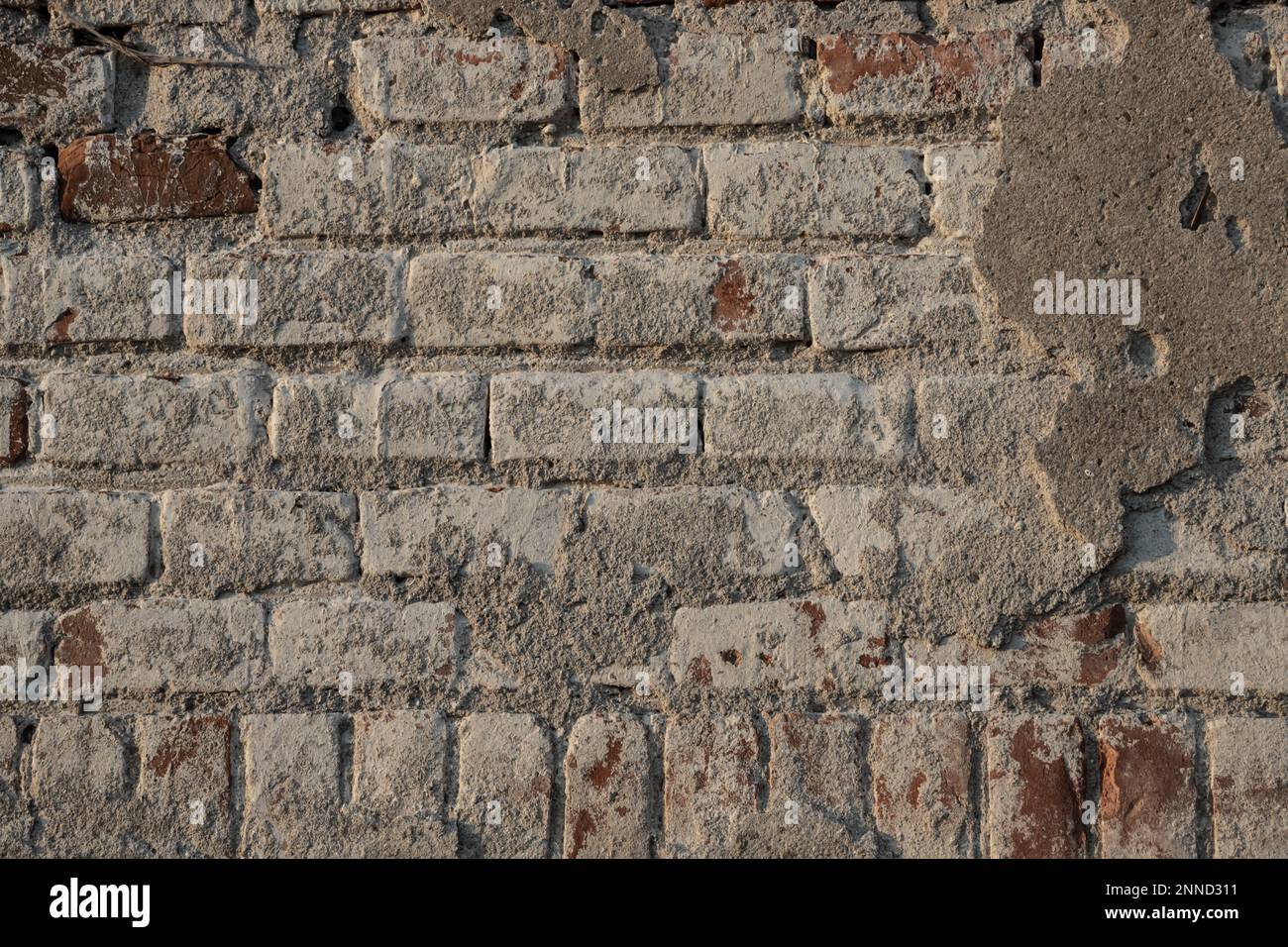 Background of old vintage dirty brick wall with peeling plaster ...
