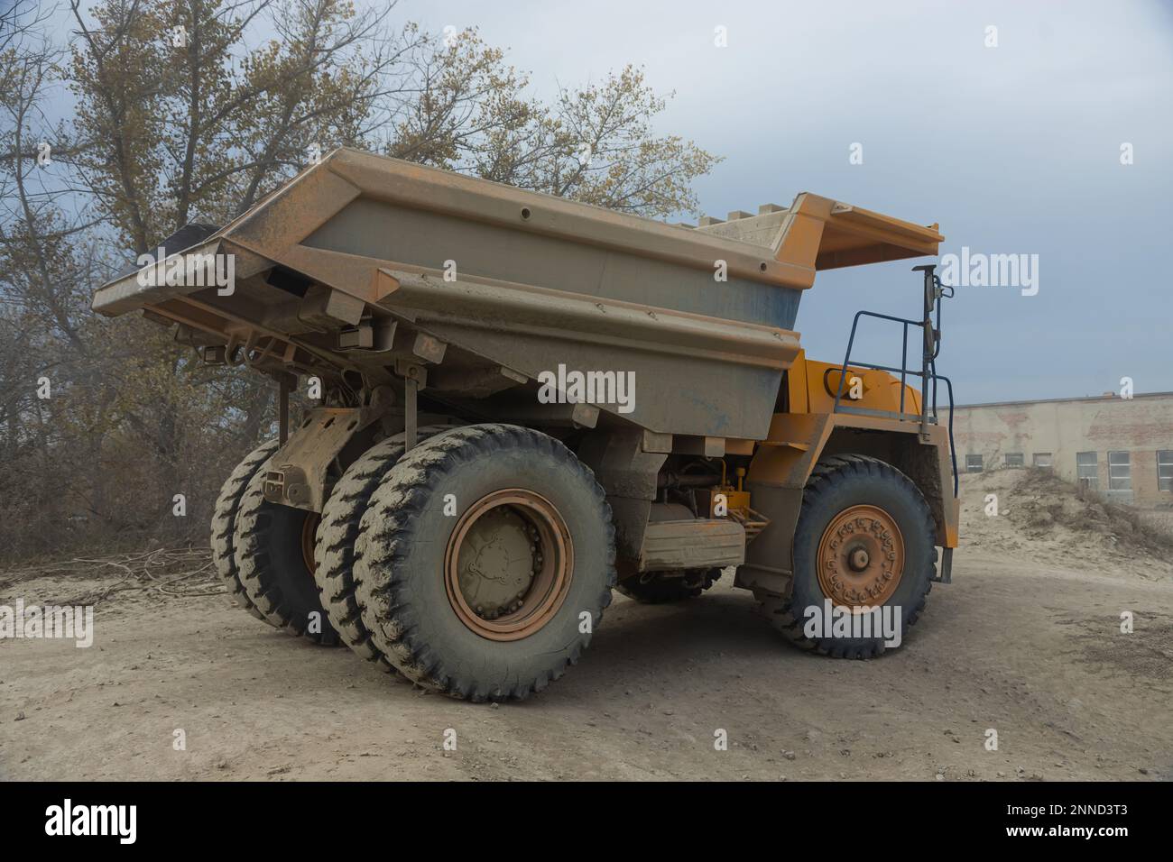 Large mining dump truck. Transport industry. Extraction of stone in an open pit. Stock Photo
