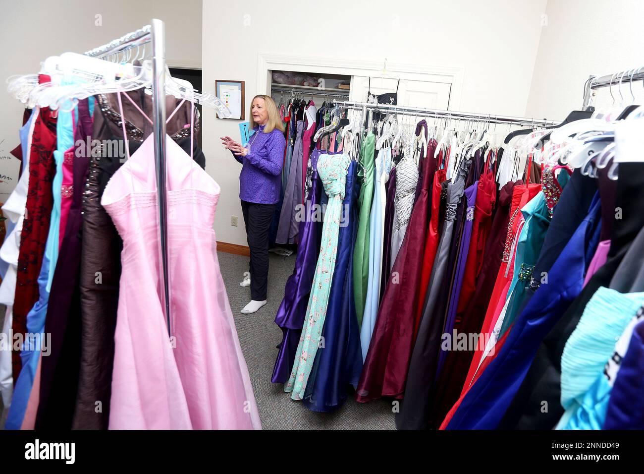 Jean Richardson speaks about the hundreds of prom dresses inside her north  Cheyenne, Wyo., home, Tuesday, April 27, 2021. Richardson, the founder of  Project Prom Cheyenne, has collected prom dresses for 15