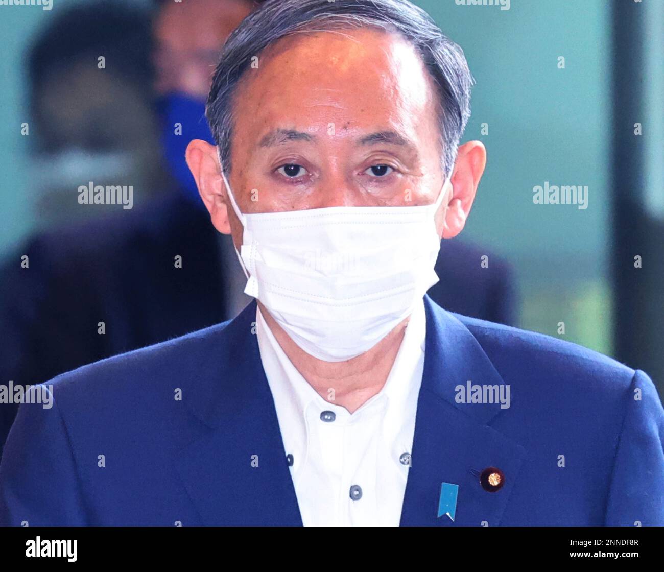 Japan's Prime Minister Yoshihide Suga arrives at the prime minister's  office in Tokyo on May 6, 2021. Suga wearing face mask entered his office  amid continuing worries over the new coronavirus COVID-19. (