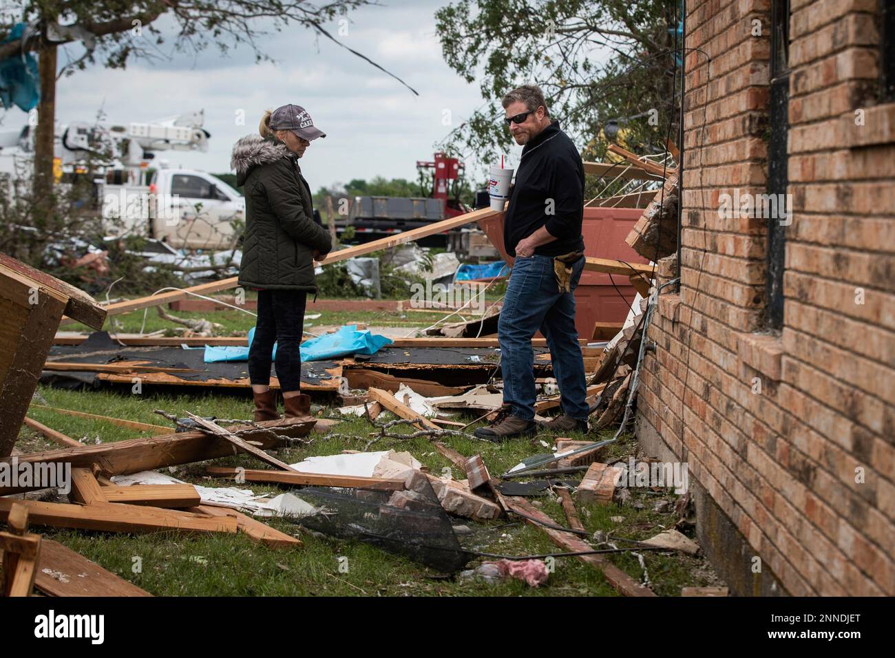 Cathy Haley and Brad Levy look over damage to the lodge at the Barn on