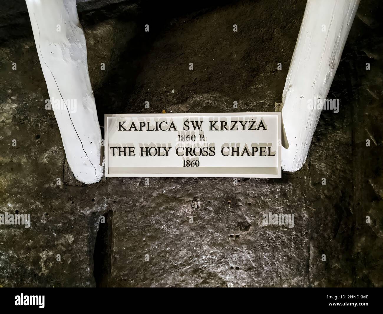 The Holy Cross Chapel - information board. Wieliczka Salt Mine. The mine was inscribed on the UNESCO World Heritage List in 1978. Stock Photo