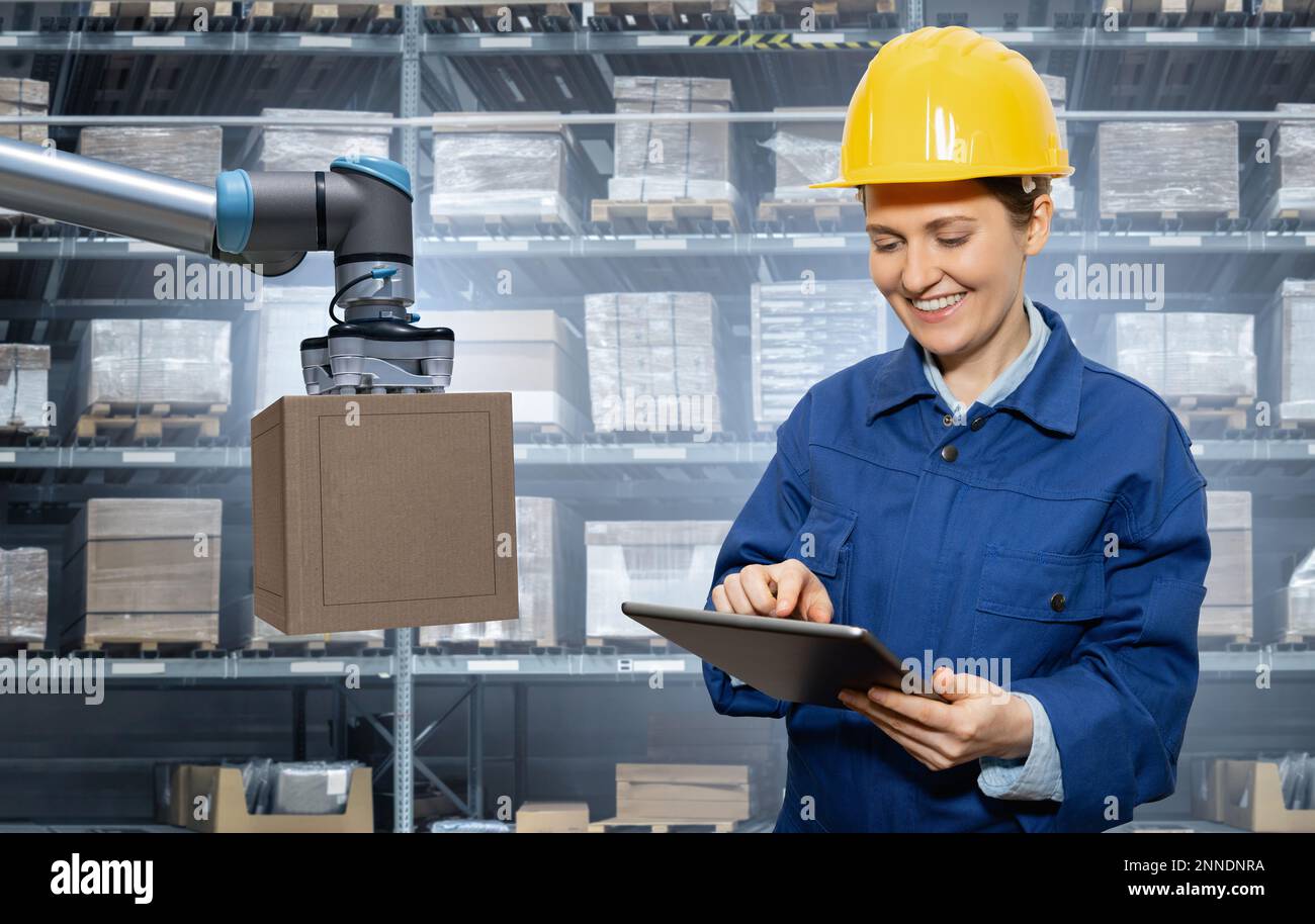 Manager with digital tablet in an automated warehouse Stock Photo