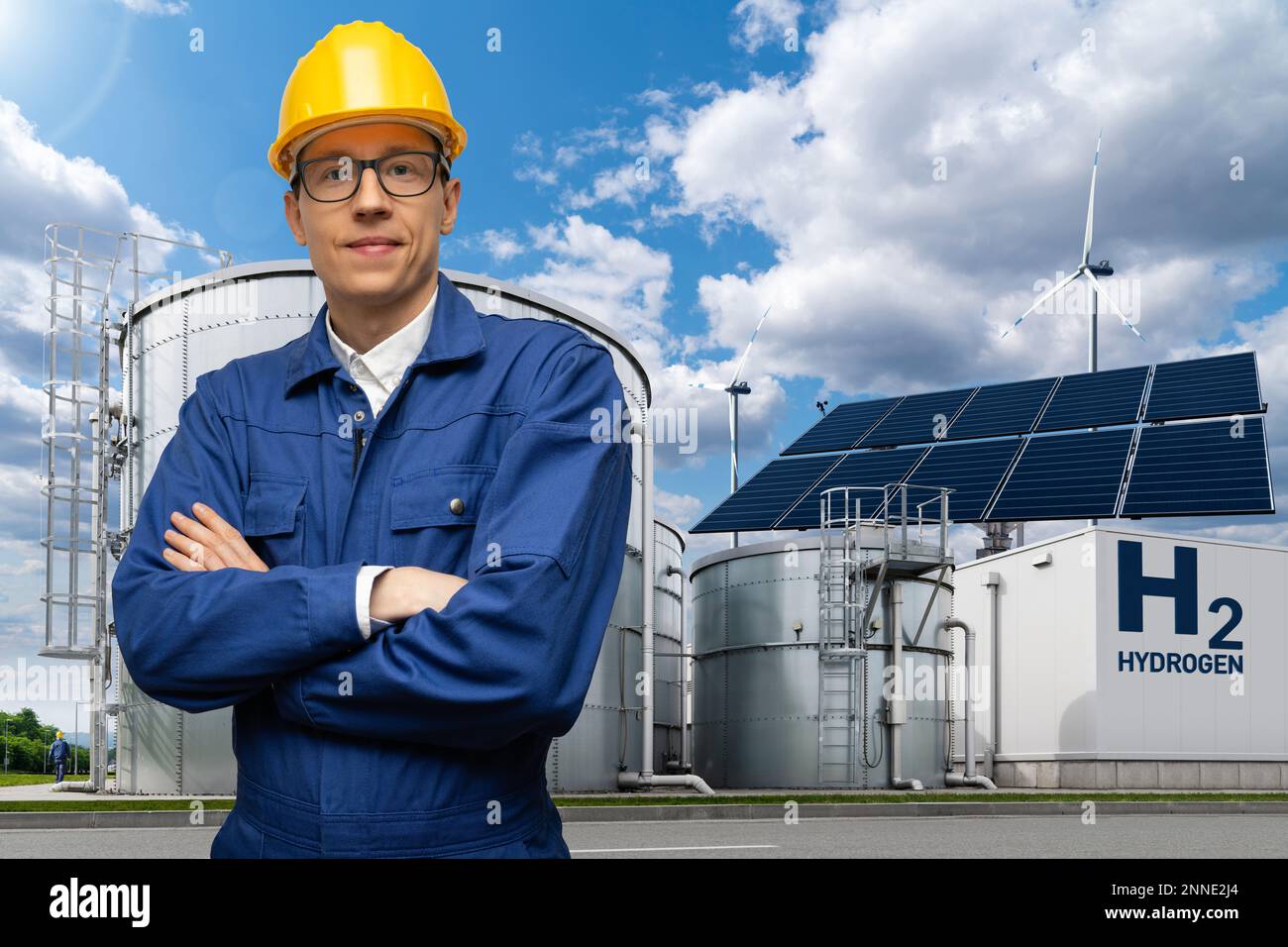 Engineer in helmet on a background of Hydrogen factory Stock Photo