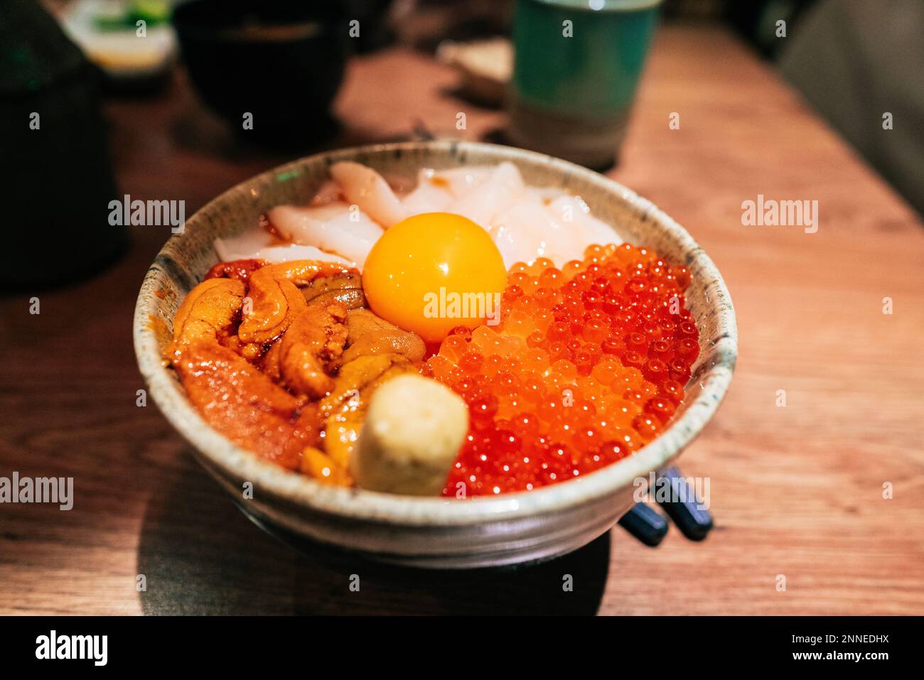Japanese food Chirashi. Sliced raw fish, shrimp, urchin, scallion
