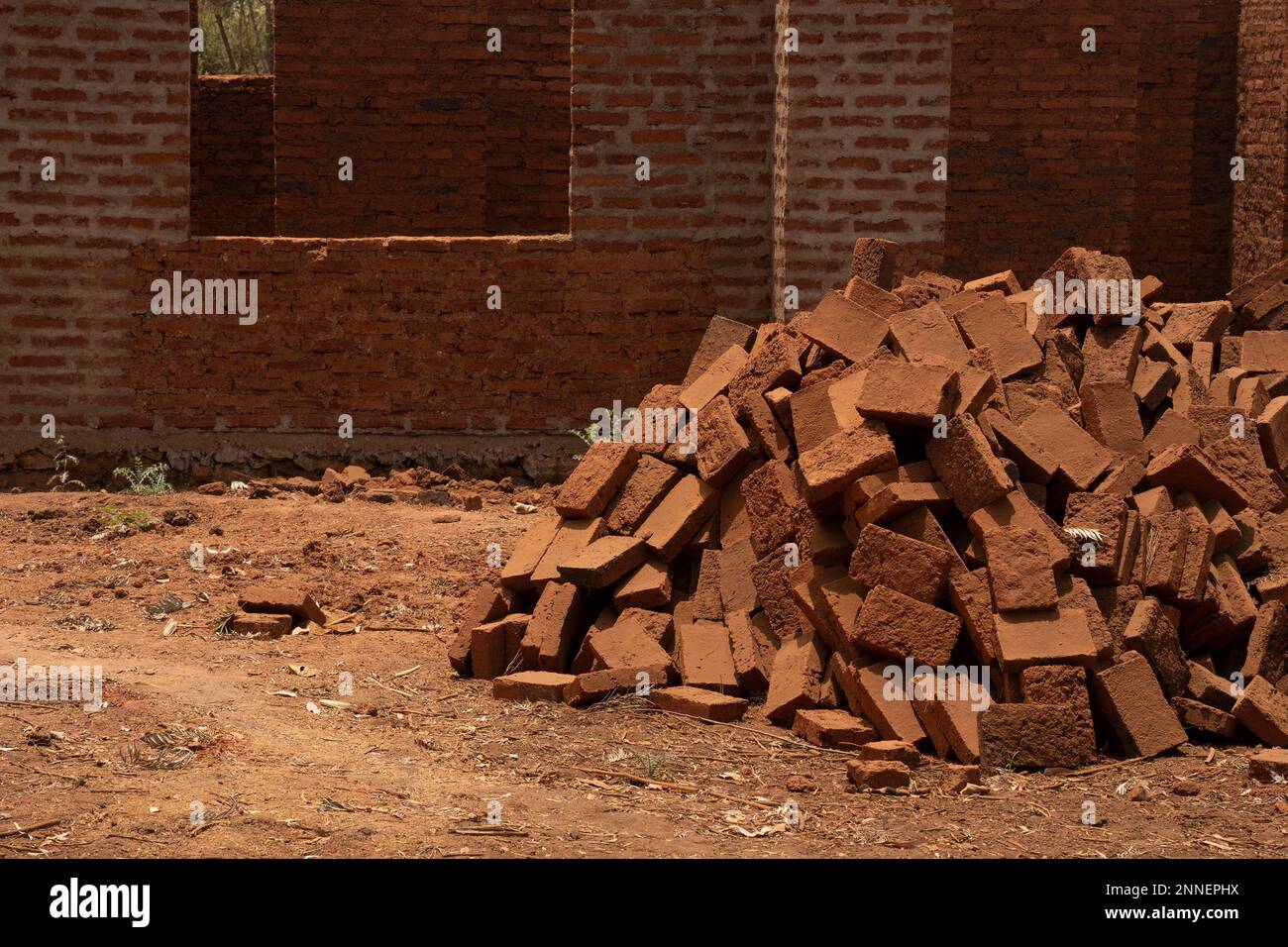 A pile of burnt mud bricks, a common building material in Africa, in