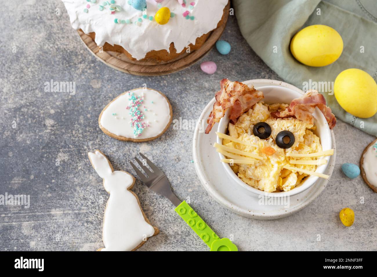Scrambled eggs easter bunny on a stone background. Easter breakfast idea. Copy space. Stock Photo