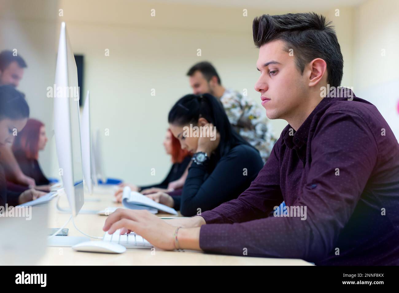 Young people in programming school.Students Learning In A Programing ...