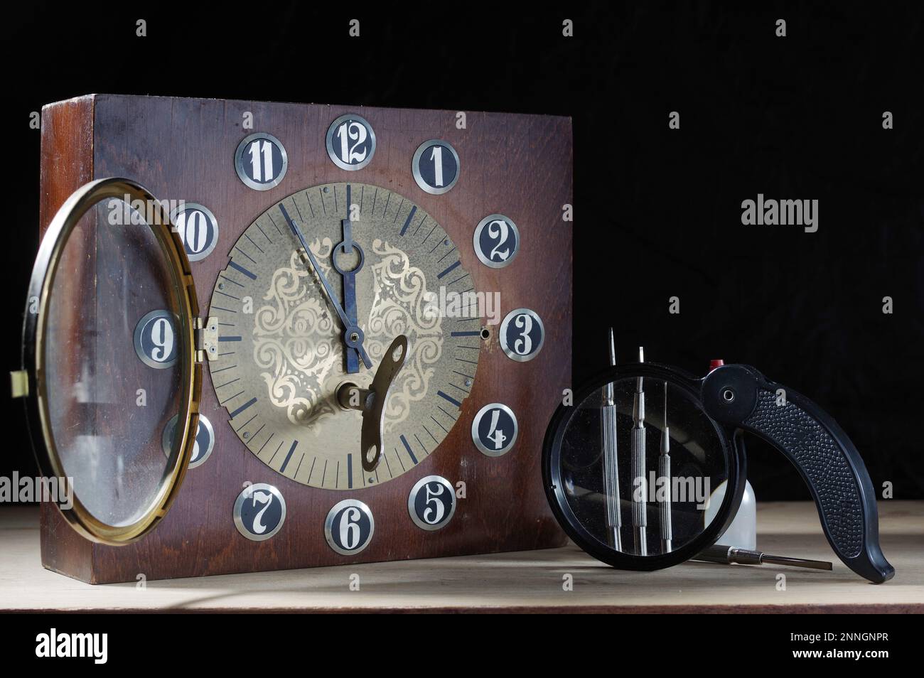 Old clocks and tools. Repair of old clocks. Watches and watch screwdrivers. Magnifier and