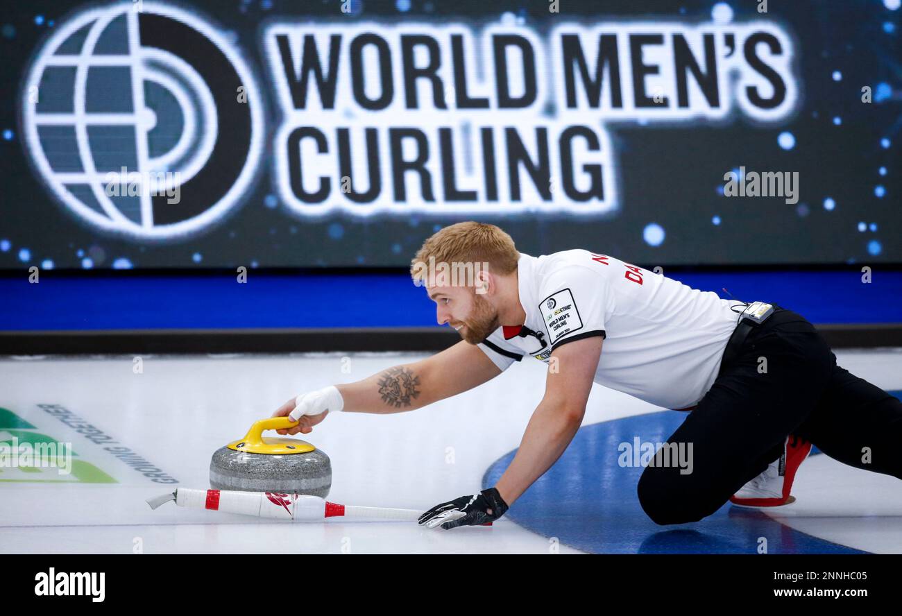 Denmark skip Mads Norgaard makes a shot against Germany at the Mens World Curling Championships in Calgary, Alberta, Tuesday, April 6, 2021