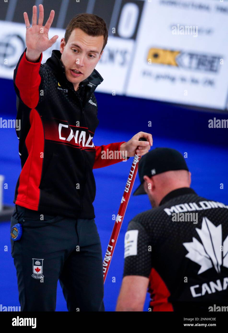 Team Canada skip Brendan Bottcher gestures to his teammates as they play Italy at the men's