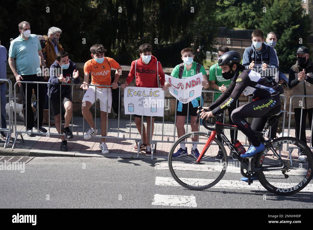 Young people cheer on a cyclist during the first stage of the Itzulia 2021,  on April 5, 2021, in Bilbao, Euskadi (Spain). Bilbao hosts this Monday the  start of the 60th edition
