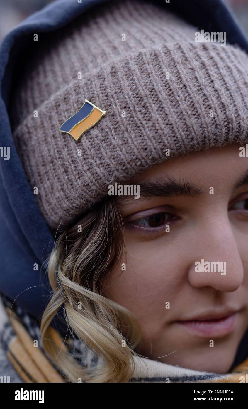 Support Ukraine concept. Close up Portrait of woman with Ukrainian flag icon. Stock Photo