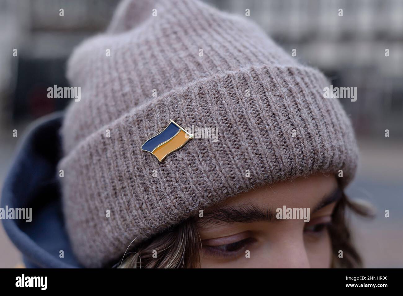 Support Ukraine concept. Close up Portrait of woman with Ukrainian flag icon. Stock Photo