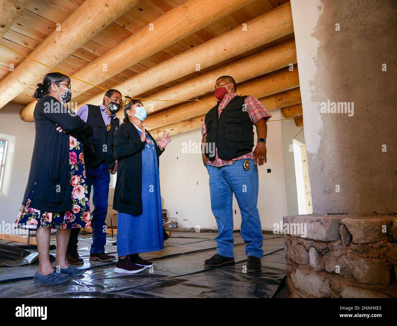This March 30, 2021 image shows Joyce Zamora, center, walking through
