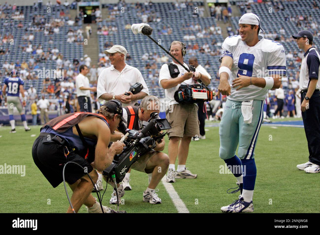 09 September 2007 - Television cameras from NFL Films and NBC Sports get  close ups of Tony Romo (9) of the Dallas Cowboys before the Cowboys 45-35  win over the New York