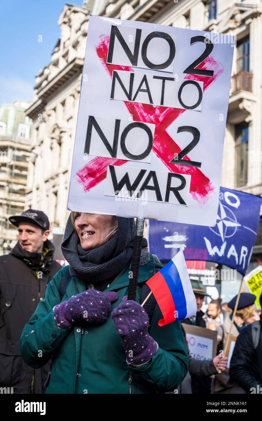 Woman with a Russian flag and pro-Russian placard 'No 2 NATO, No2 War ...