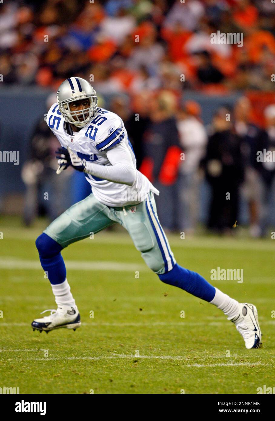 16 August 2008 - Evan Oglesby (23) and Patrick Watkins (25) of the Dallas  Cowboys tackle Brandon Stokley (14) of the Denver Broncos during the Cowboys  preseason game with the Broncos at