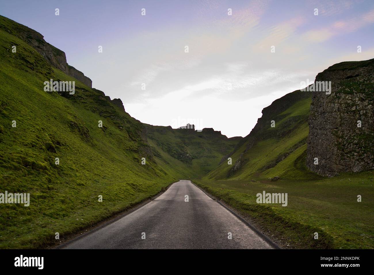 Winnats Pass, a road (hill pass and limestone gorge) in the Peak District National Park, Derbyshire, at sunset. Stock Photo