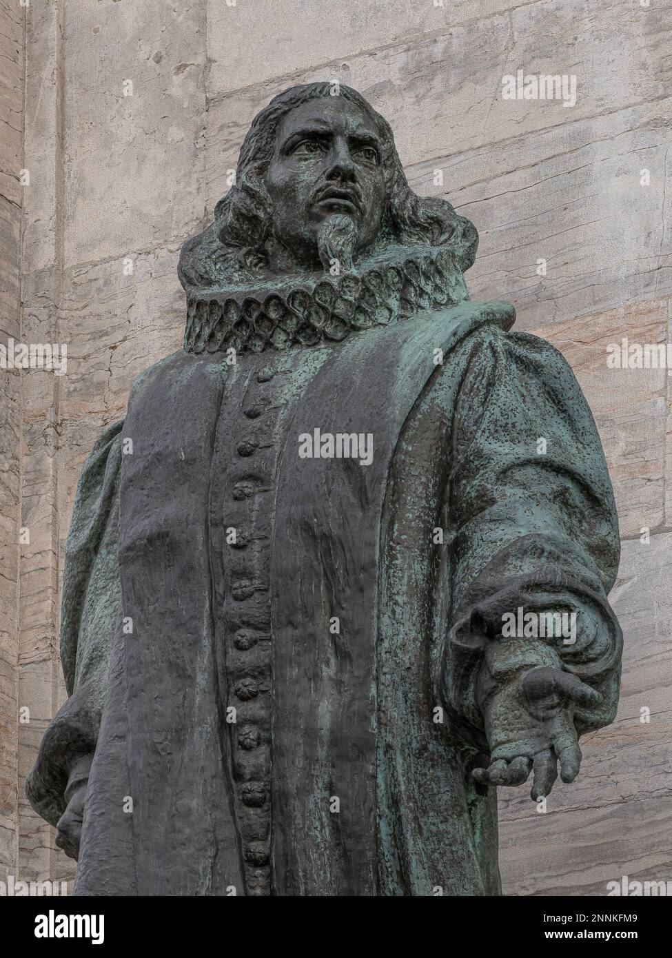 a bronze statue of the Danish bishop, poet and hymn-writer Thomas Kingo in front of the Marble Church in Copenhagen, February 18, 2023 Stock Photo
