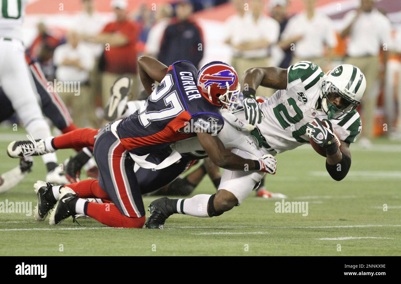 New York Jets running back Thomas Jones (20) is tackled at