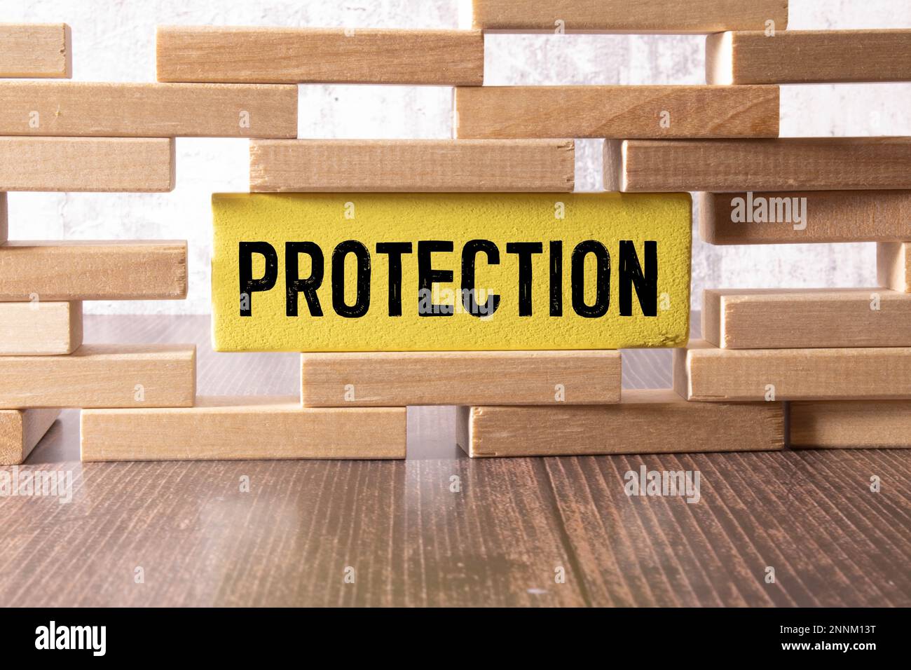 the word of PROTECT on wooden cubes. Stock Photo