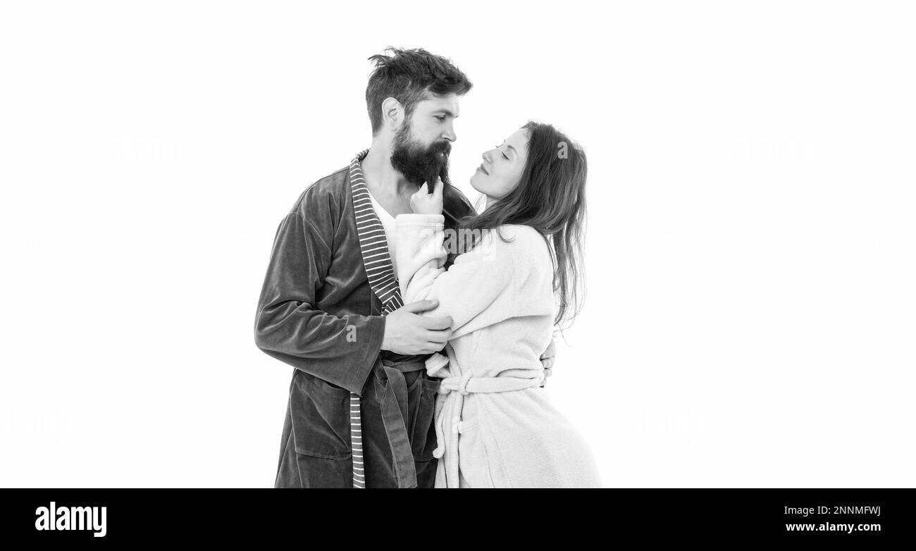 Weary but pleased. Couple in love. Family couple in robes. Sleepy man