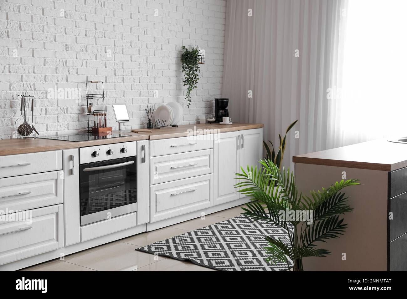 Interior of light kitchen with white counters and electric oven Stock ...
