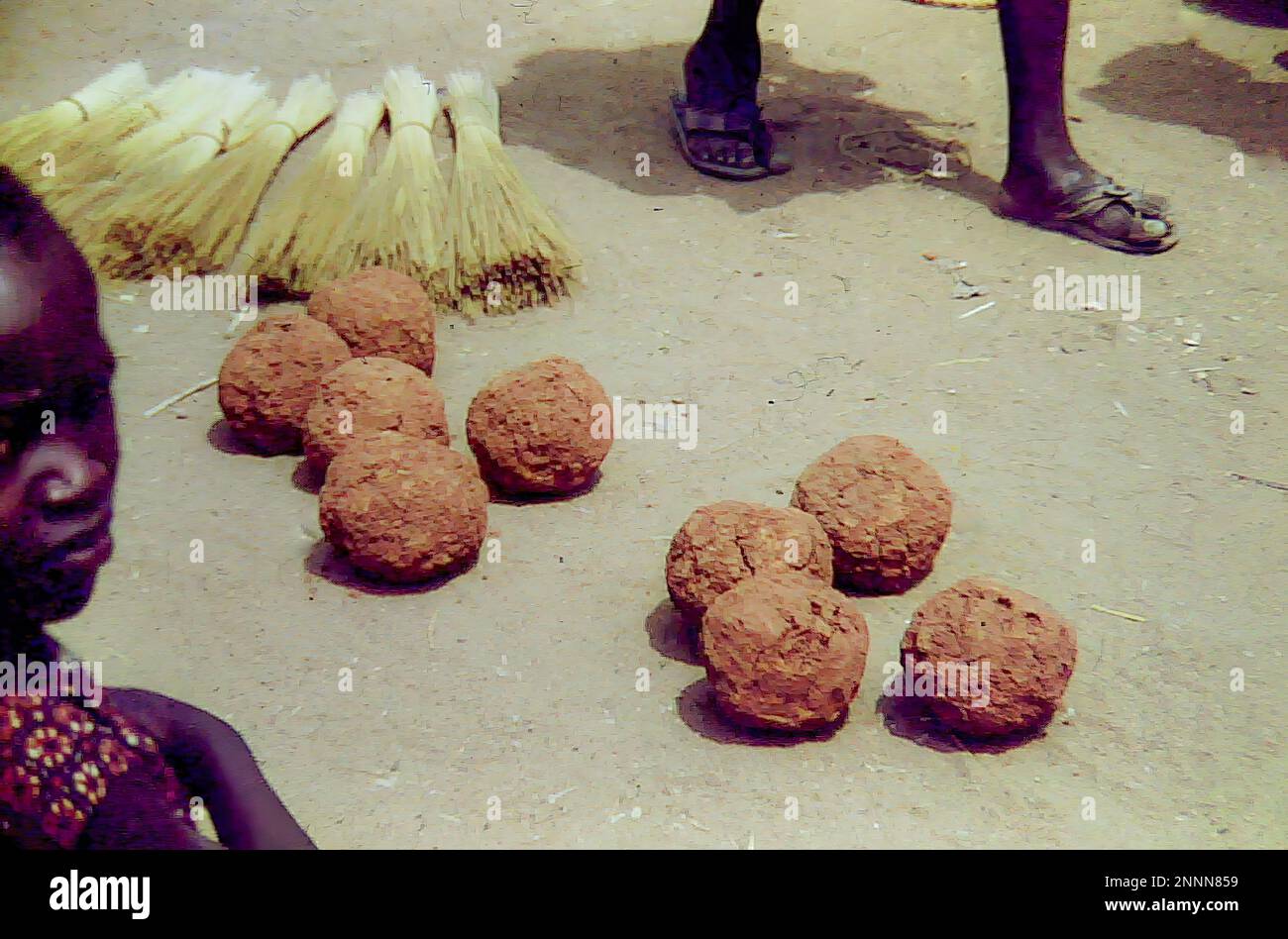 Balls of tobacco on sale at an outdoor market in Bolgatanga, Ghana c.1958 Stock Photo